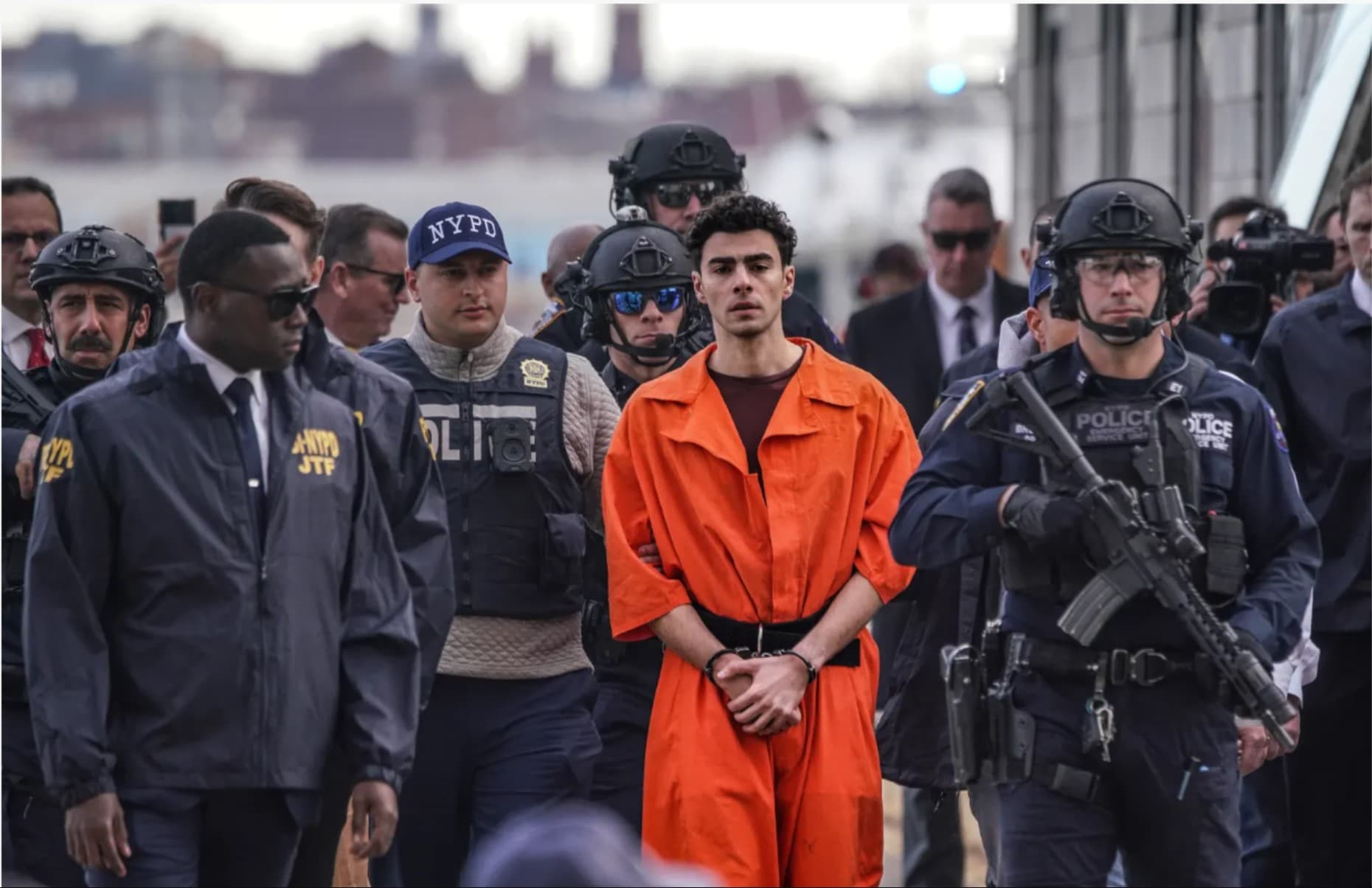 Luigi Mangione arriving in Manhattan surrounded by heavily-armed police and federal agents on Dec. 19, 2024